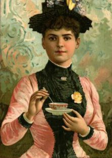 Woman holding tea cup and saucer
