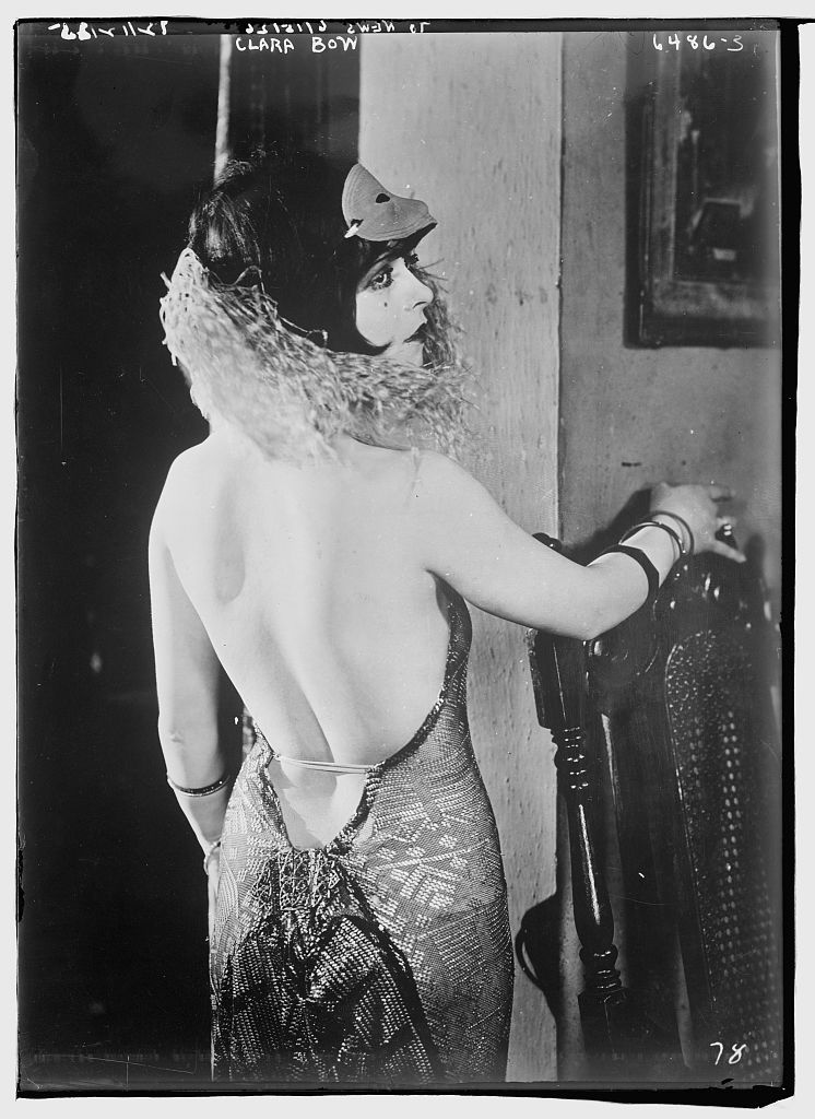 A 1922 photograph of actress Clara Bow in a daring backless dress. From the U.S. Library of Congress.