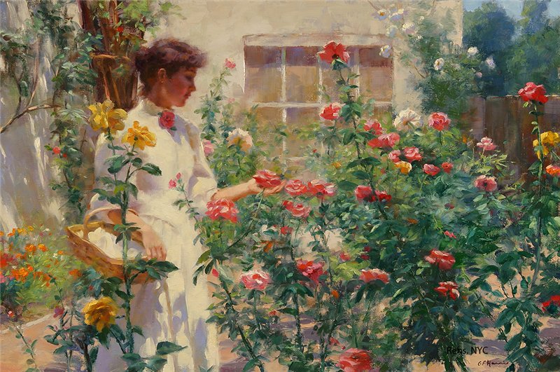 Painting of young woman dressed in white gown in style of 1910, standing amid a cluster of tall rose bushes of different colors. Over her arm she carries a basket. With her other hand she cups a pink rose.