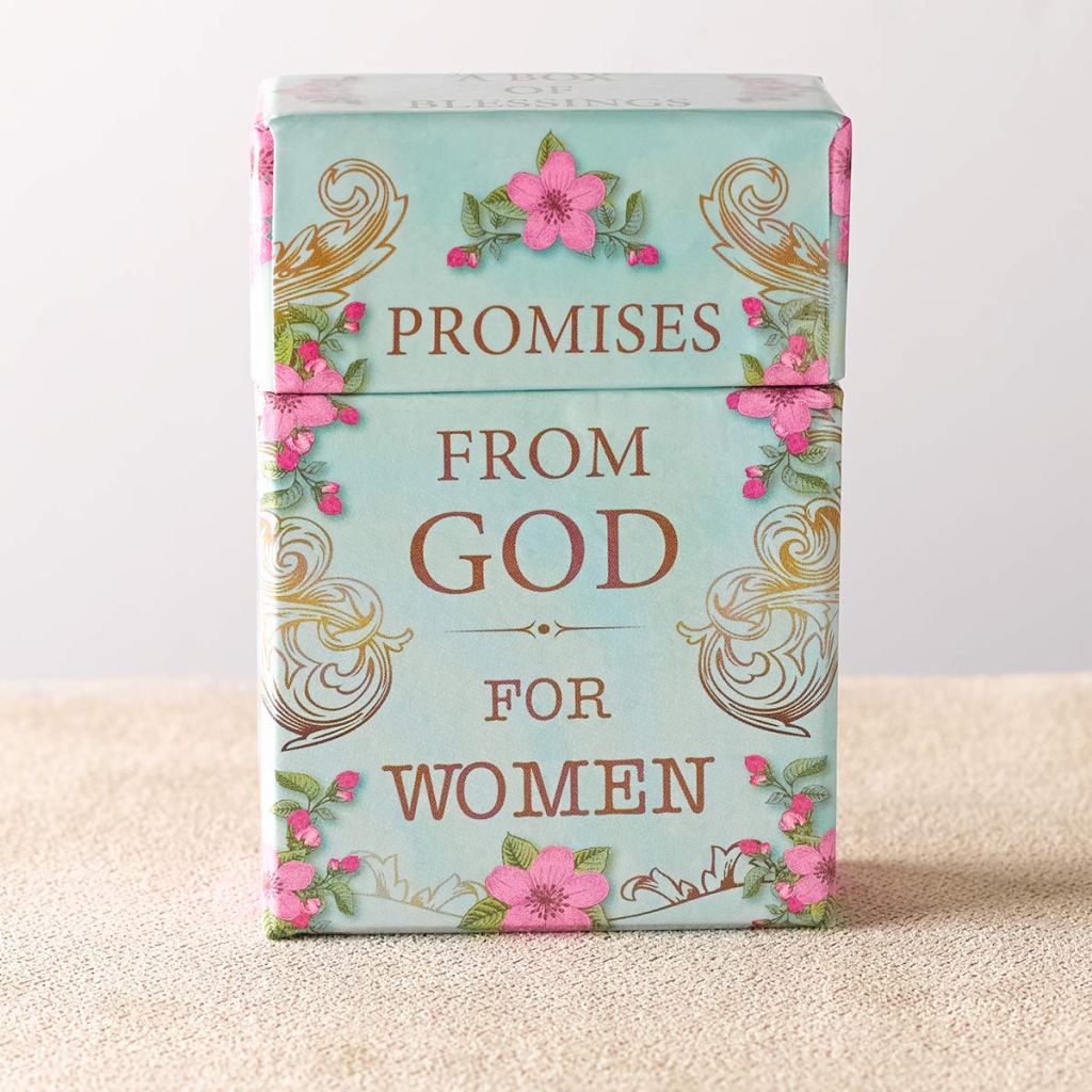Photo of the box of cards. Light blue background with pink flowers and gold filigree decorating the edges. The center has gold text that reads "Promises from God for Women"