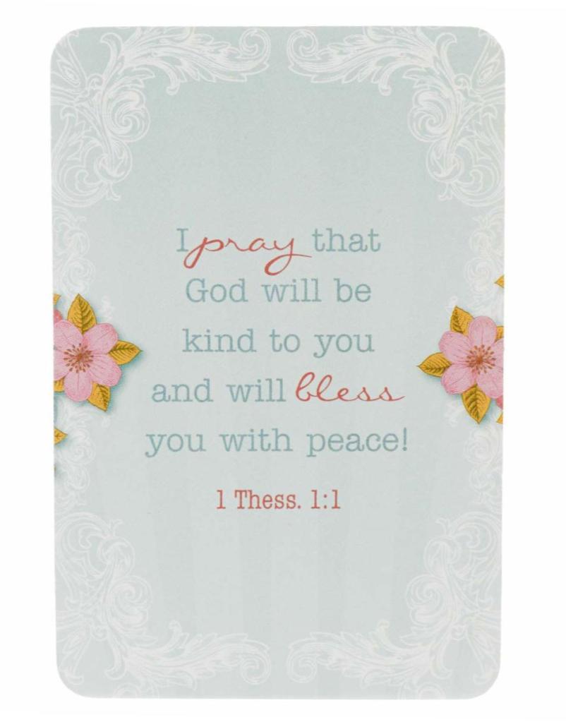 Image of card. Light blue background with white lace borders and a flower on the left and right sides. The center reads: I pray that God will be kind to you and will bless you with peace! 1 Thess. 1:1